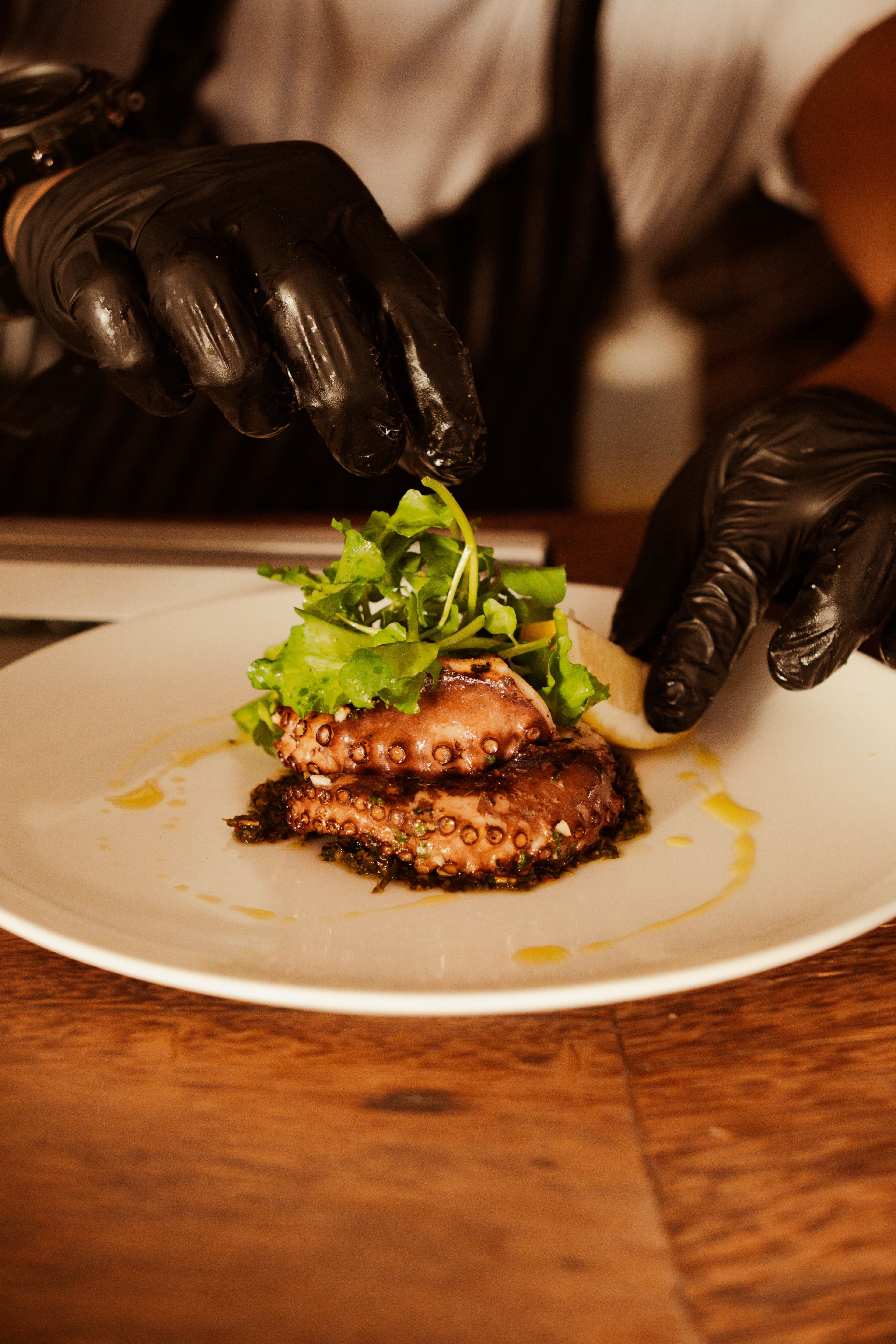 A chef plating in the kitchen before a departure